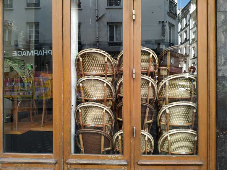 a closed restaurant with the chairs stored inside